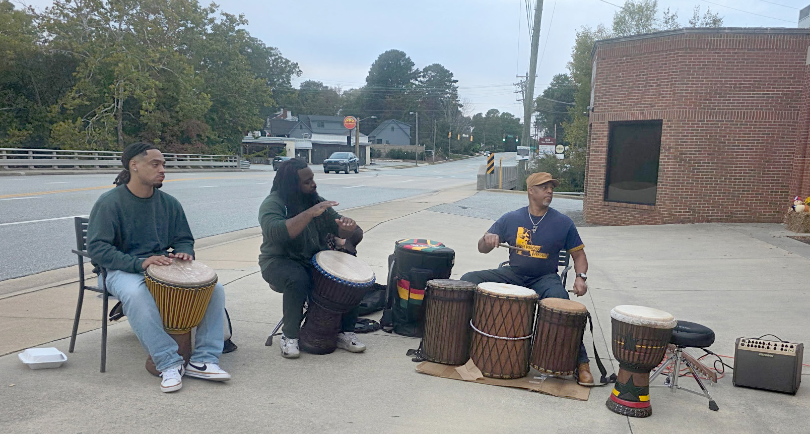 Drummers playing outside Saint Louis Saveurs