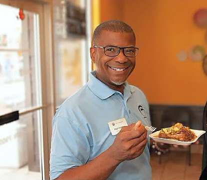 A guest enjoying a plate at Saint Louis Saveurs